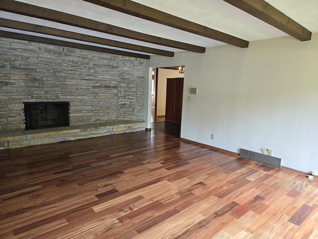 1720 Stratford Ln, Rockford, IL 61107 - unfurnished living room featuring beam ceiling, wood finished floors, baseboards, and a fireplace