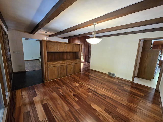 1720 Stratford Ln, Rockford, IL 61107 - unfurnished living room with dark wood-style floors, beamed ceiling, and baseboards