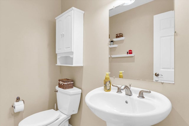 402 Cypress Ct, Saint Joseph, IL 61873 - half bath featuring a sink and toilet
