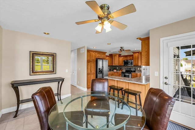 402 Cypress Ct, Saint Joseph, IL 61873 - dining space featuring baseboards, a ceiling fan, light tile patterned floors, and recessed lighting