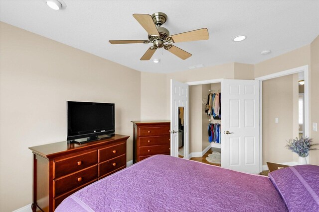 402 Cypress Ct, Saint Joseph, IL 61873 - bedroom with baseboards, recessed lighting, a ceiling fan, and a walk in closet