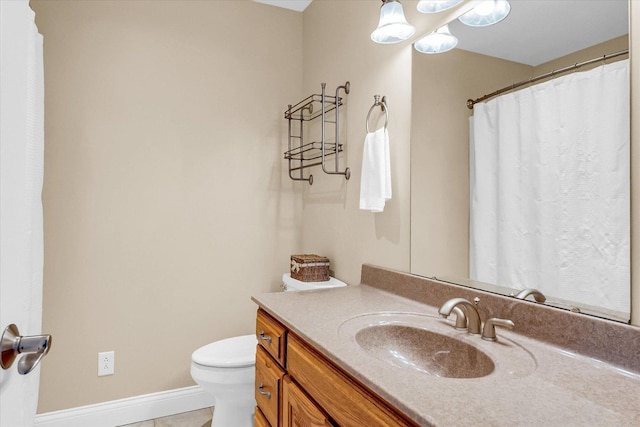 402 Cypress Ct, Saint Joseph, IL 61873 - full bath with toilet, vanity, tile patterned floors, and baseboards