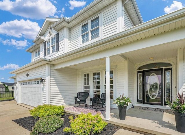 402 Cypress Ct, Saint Joseph, IL 61873 - entrance to property featuring a porch, a garage, and driveway