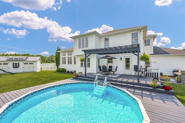 402 Cypress Ct, Saint Joseph, IL 61873 - back of house featuring a pergola, a wooden deck, outdoor dining area, an outdoor structure, and an outdoor pool