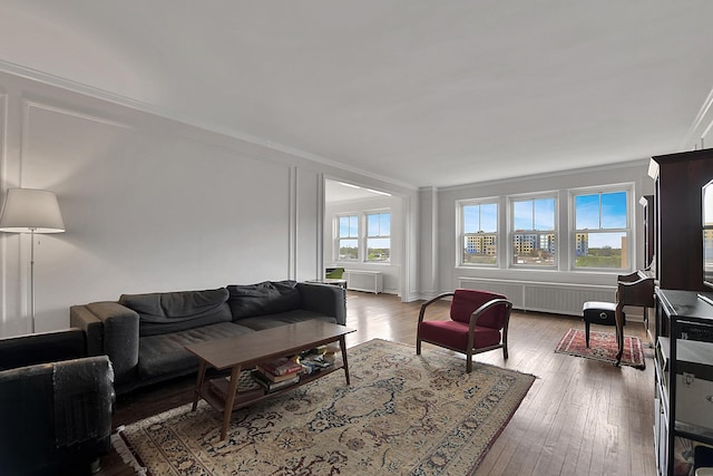 5555 N Sheridan Rd Unit 507, Chicago, IL 60640 - living room with radiator, hardwood / wood-style floors, and crown molding