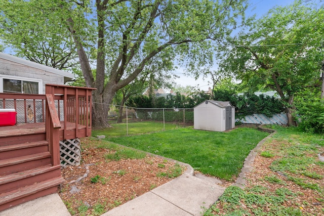 4308 Oak St, Bellwood, IL 60104 - fenced backyard with a storage unit and a deck