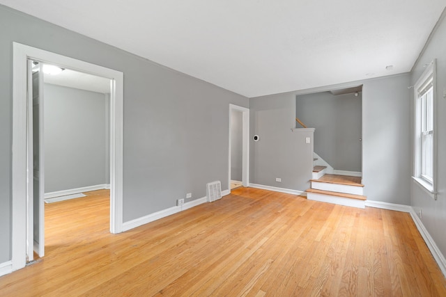 4308 Oak St, Bellwood, IL 60104 - spare room with light wood-type flooring and stairs