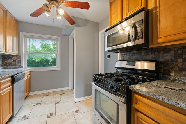 4308 Oak St, Bellwood, IL 60104 - kitchen with appliances with stainless steel finishes, tasteful backsplash, brown cabinets, and ceiling fan