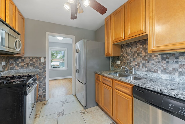 4308 Oak St, Bellwood, IL 60104 - kitchen featuring stainless steel appliances, a ceiling fan, light stone countertops, and backsplash