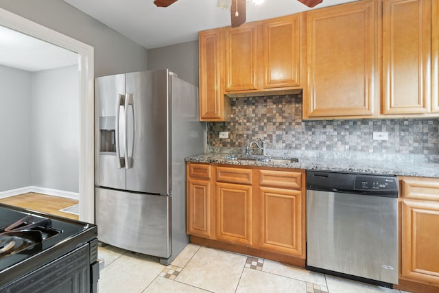 4308 Oak St, Bellwood, IL 60104 - kitchen with stainless steel appliances, a ceiling fan, backsplash, and stone countertops