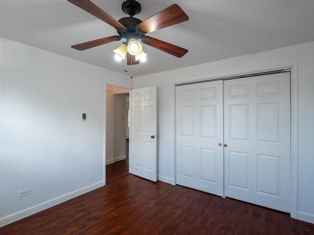 6862 W Lode Dr Unit 3A, Worth, IL 60482 - unfurnished bedroom with baseboards, dark wood-type flooring, a closet, and a ceiling fan