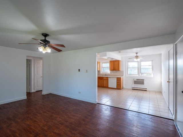 6862 W Lode Dr Unit 3A, Worth, IL 60482 - unfurnished living room featuring ceiling fan, baseboards, baseboard heating, light wood-style floors, and an AC wall unit