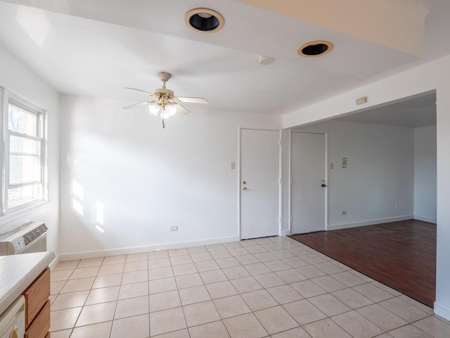 6862 W Lode Dr Unit 3A, Worth, IL 60482 - spare room with ceiling fan, light tile patterned flooring, a wall mounted air conditioner, baseboards, and a smoke detector