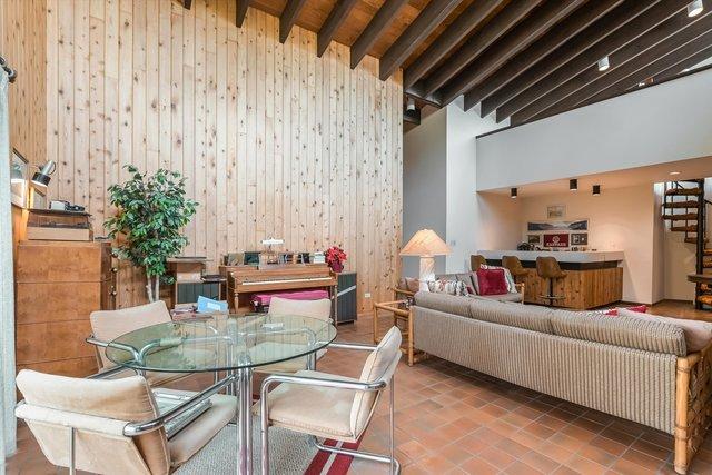 1314 S Chester Ave, Park Ridge, IL 60068 - tiled dining room with a towering ceiling and wood walls