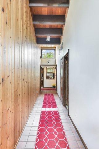 1314 S Chester Ave, Park Ridge, IL 60068 - hall with wooden walls and light tile patterned floors