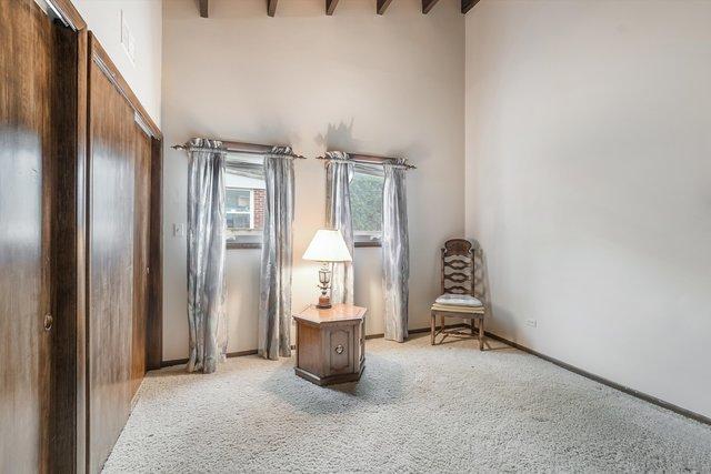 1314 S Chester Ave, Park Ridge, IL 60068 - sitting room with light carpet, beamed ceiling, and a high ceiling