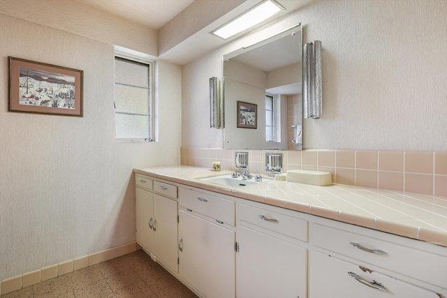 1314 S Chester Ave, Park Ridge, IL 60068 - bathroom with vanity, tile patterned floors, and baseboards