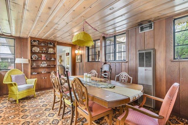 1314 S Chester Ave, Park Ridge, IL 60068 - dining room featuring wooden ceiling, wood walls, and a heating unit