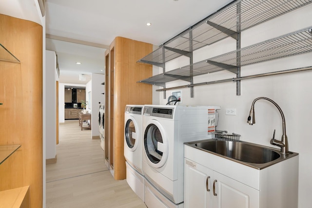 1 E Schiller St Unit 8B, Chicago, IL 60610 - laundry room featuring separate washer and dryer, light wood-style flooring, and recessed lighting