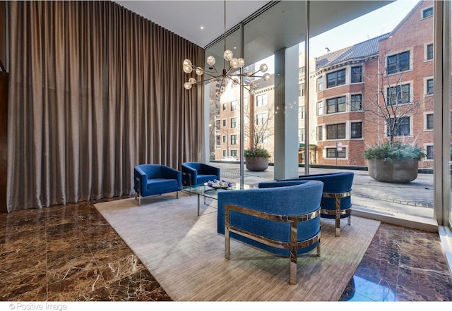 1 E Schiller St Unit 8B, Chicago, IL 60610 - community lobby with a high ceiling and floor to ceiling windows
