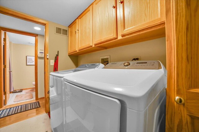 6719 W White Tailed Ln Unit 3E, Tinley Park, IL 60477 - washroom featuring cabinet space, independent washer and dryer, light wood-style flooring, and recessed lighting