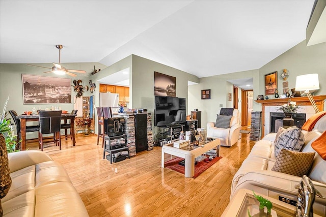 6719 W White Tailed Ln Unit 3E, Tinley Park, IL 60477 - living area with a ceiling fan, lofted ceiling, light wood-style floors, and a tile fireplace
