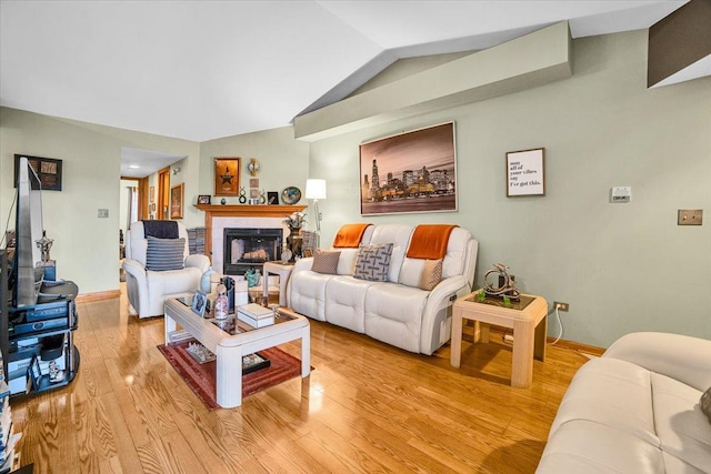 6719 W White Tailed Ln Unit 3E, Tinley Park, IL 60477 - living area featuring light wood-style flooring, lofted ceiling, baseboards, and a fireplace