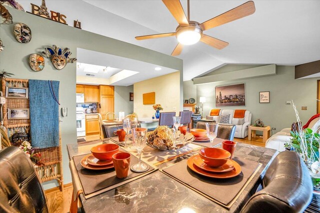 6719 W White Tailed Ln Unit 3E, Tinley Park, IL 60477 - dining room with a ceiling fan, baseboards, a skylight, and vaulted ceiling