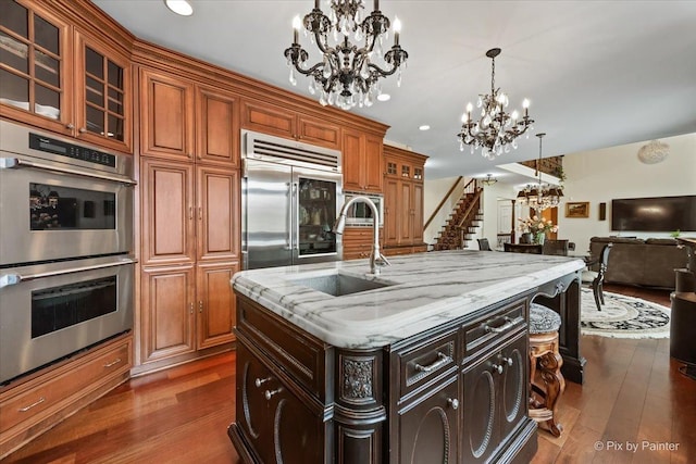 11 Moate Ln, Barrington Hills, IL 60010 - kitchen featuring appliances with stainless steel finishes, a chandelier, a sink, dark wood-style floors, and recessed lighting