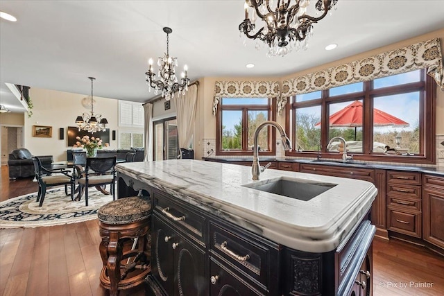 11 Moate Ln, Barrington Hills, IL 60010 - kitchen with a chandelier, a sink, a kitchen island with sink, dark wood-style flooring, and recessed lighting