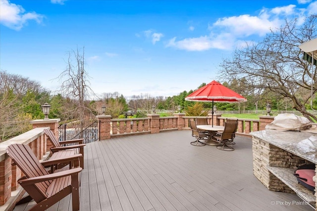 11 Moate Ln, Barrington Hills, IL 60010 - deck with outdoor dining space and an outdoor kitchen