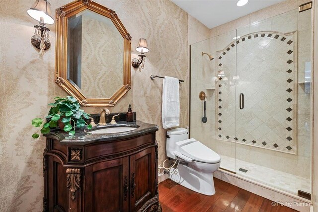 11 Moate Ln, Barrington Hills, IL 60010 - bathroom featuring wood finished floors, toilet, vanity, a stall shower, and wallpapered walls