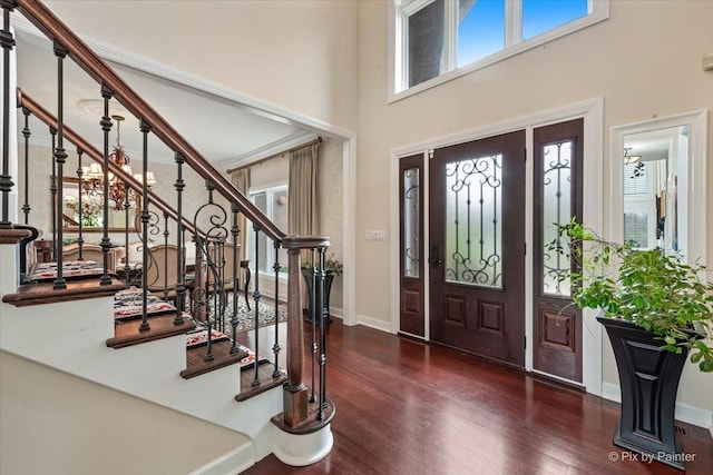 11 Moate Ln, Barrington Hills, IL 60010 - entrance foyer featuring hardwood / wood-style flooring, stairs, a towering ceiling, and baseboards