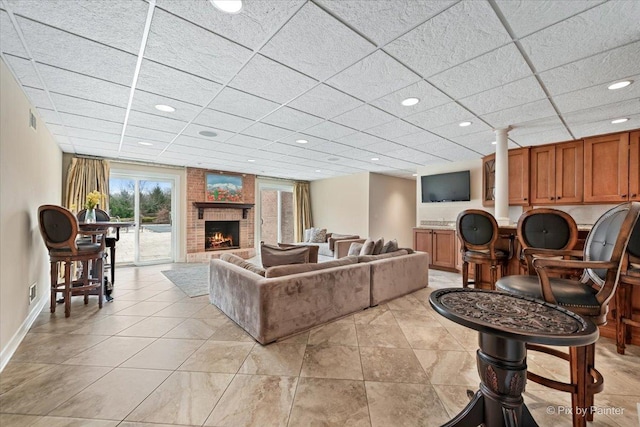 11 Moate Ln, Barrington Hills, IL 60010 - living area with a fireplace, baseboards, recessed lighting, light tile patterned flooring, and a paneled ceiling