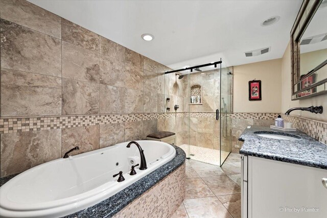 11 Moate Ln, Barrington Hills, IL 60010 - bathroom featuring tile walls, vanity, a shower stall, a whirlpool tub, and tile patterned flooring