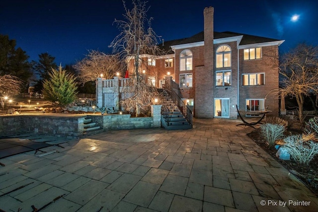 11 Moate Ln, Barrington Hills, IL 60010 - patio at twilight featuring stairs, a patio area, and cooling unit