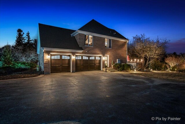 11 Moate Ln, Barrington Hills, IL 60010 - view of home's exterior featuring asphalt driveway