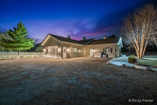 11 Moate Ln, Barrington Hills, IL 60010 - view of front of house featuring board and batten siding and a chimney