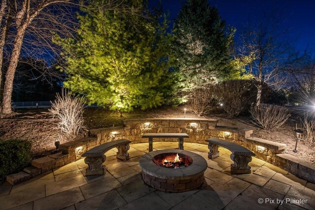11 Moate Ln, Barrington Hills, IL 60010 - patio at night featuring an outdoor fire pit and a patio