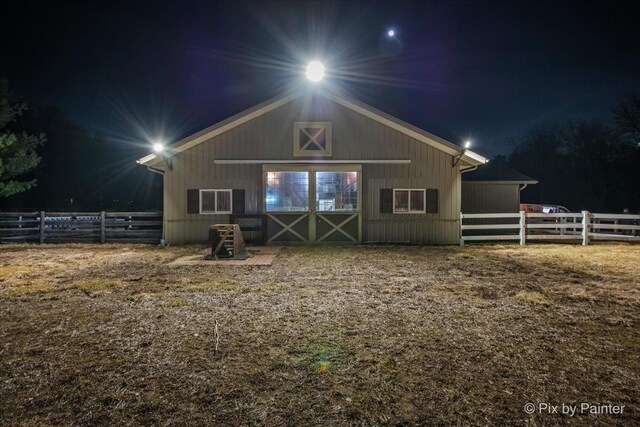 11 Moate Ln, Barrington Hills, IL 60010 - back of house at twilight featuring an outdoor structure and an exterior structure