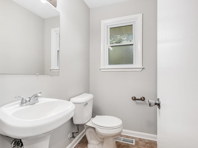 3411 Caton Farm Rd, Joliet, IL 60431 - half bath featuring baseboards, toilet, a sink, and tile patterned flooring