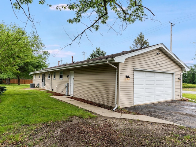 3411 Caton Farm Rd, Joliet, IL 60431 - garage featuring asphalt driveway and central AC unit