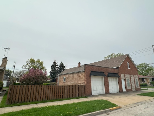 347 156th St, Calumet City, IL 60409 - view of side of property featuring brick siding, driveway, and a shingled roof