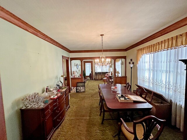 347 156th St, Calumet City, IL 60409 - dining space featuring dark colored carpet, a chandelier, and ornamental molding