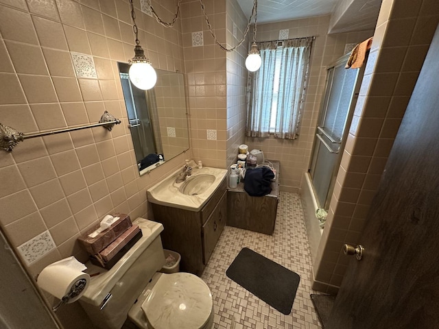 347 156th St, Calumet City, IL 60409 - full bath with tile walls, a shower with door, toilet, vanity, and tile patterned flooring