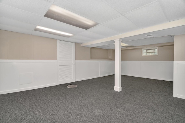 5200 S Newcastle Ave, Chicago, IL 60638 - below grade area featuring a paneled ceiling, carpet floors, and a wainscoted wall