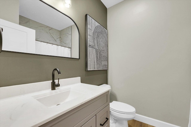 1721 S Stone Creek Blvd, Urbana, IL 61802 - bathroom featuring vanity, toilet, a shower with shower curtain, baseboards, and wood finished floors