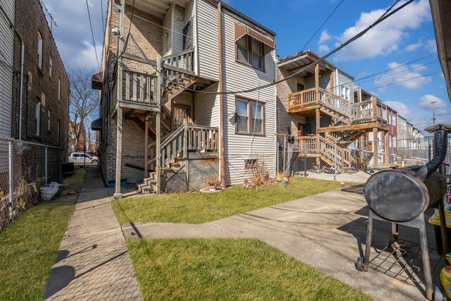 1721 N Menard Ave, Chicago, IL 60639 - rear view of property featuring a yard and brick siding