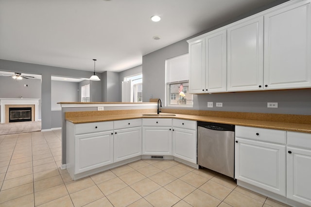 8013 Shady Oak Rd, Joliet, IL 60431 - kitchen featuring stainless steel dishwasher, a sink, a ceiling fan, a peninsula, and light tile patterned flooring