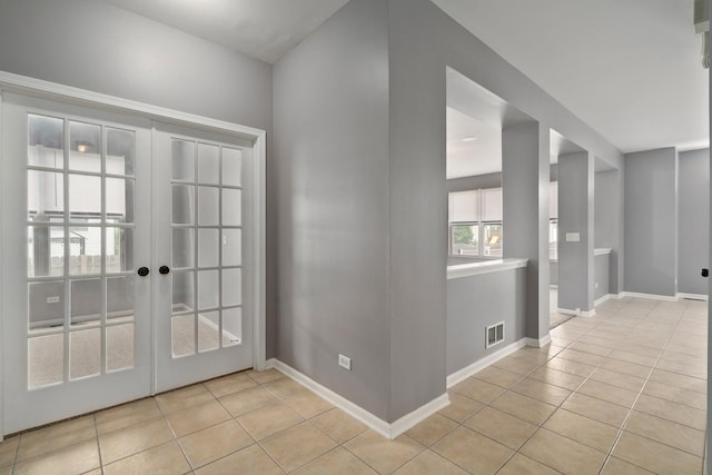 8013 Shady Oak Rd, Joliet, IL 60431 - unfurnished room featuring light tile patterned floors, french doors, and baseboards